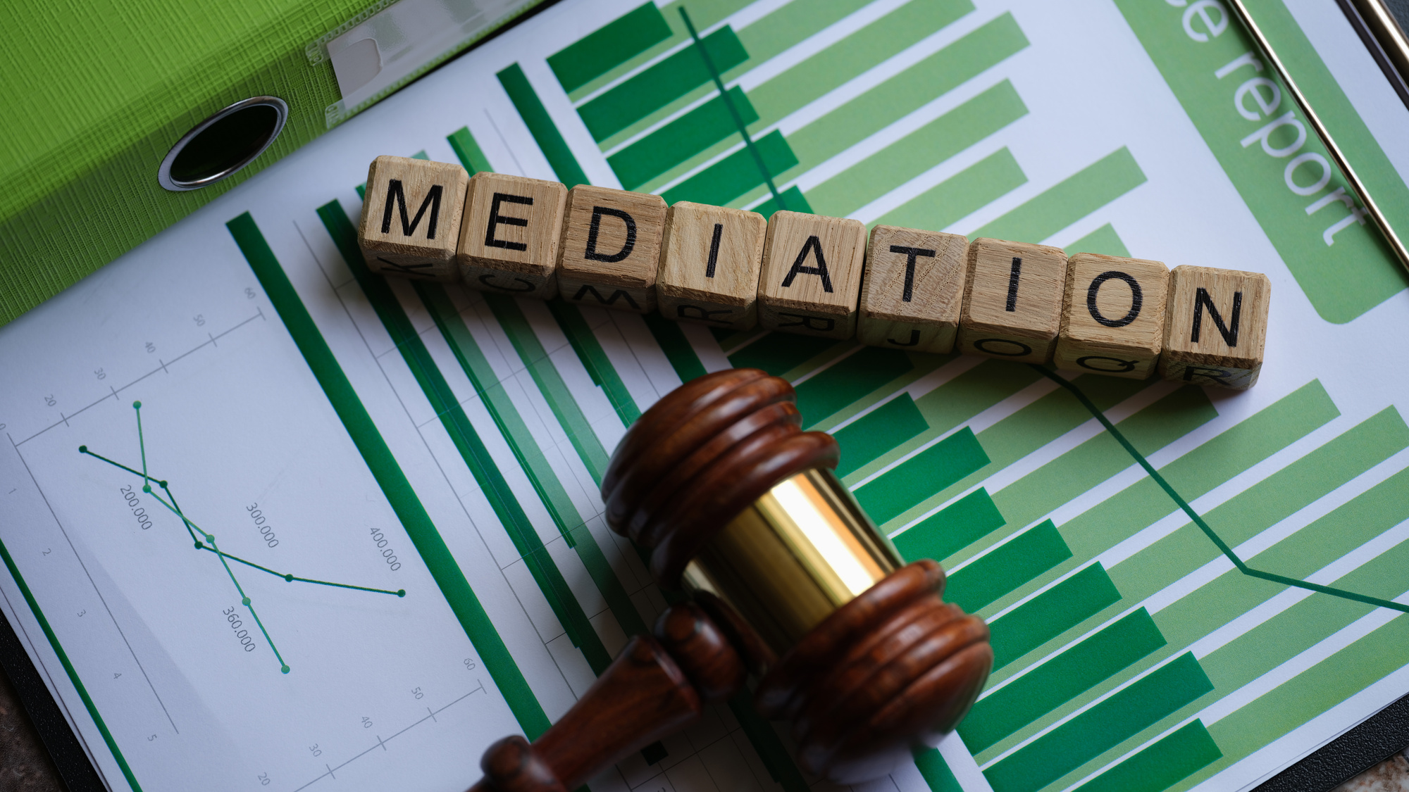 Wooden Cubes with Word Mediation and Judge Gavel on Documents